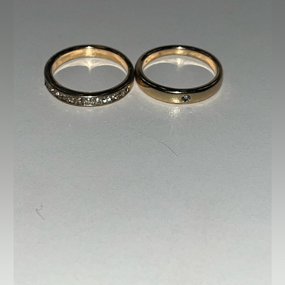 Two size 6 gold rings with jewels on them.